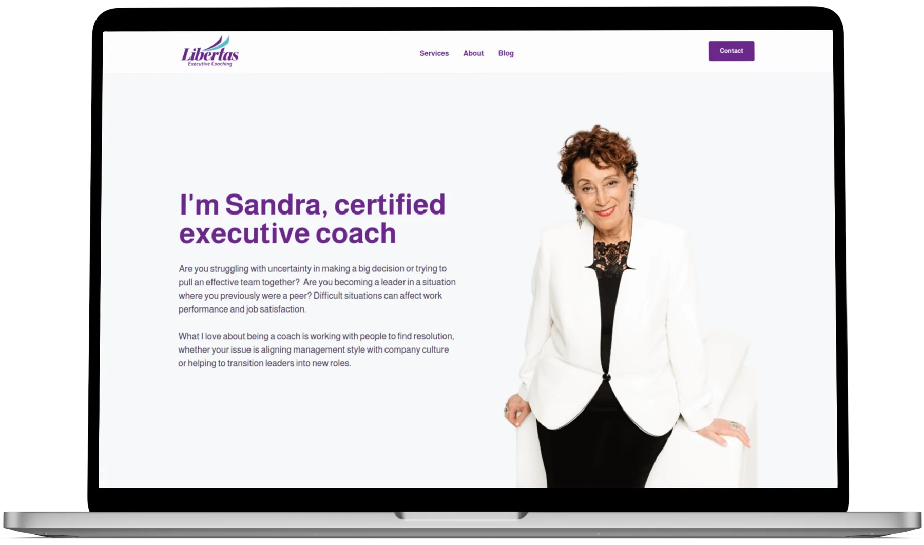 Libertas Executive Coaching website on laptop.