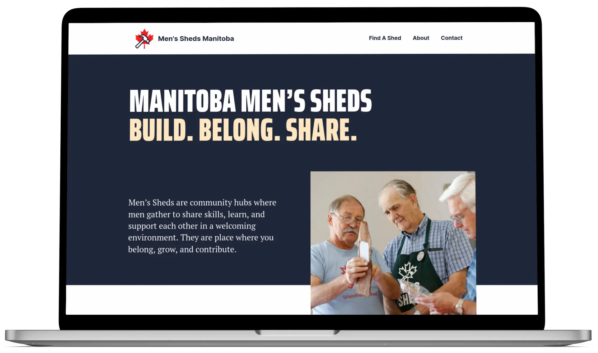 Manitoba Men's Sheds website on laptop.